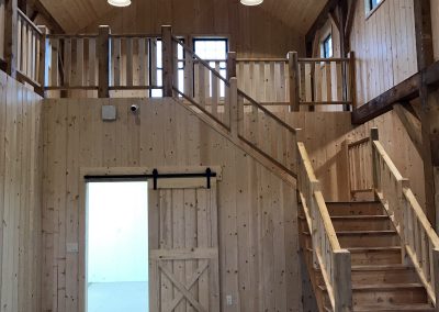 Open Concept Layout with Stairs in Barn Home